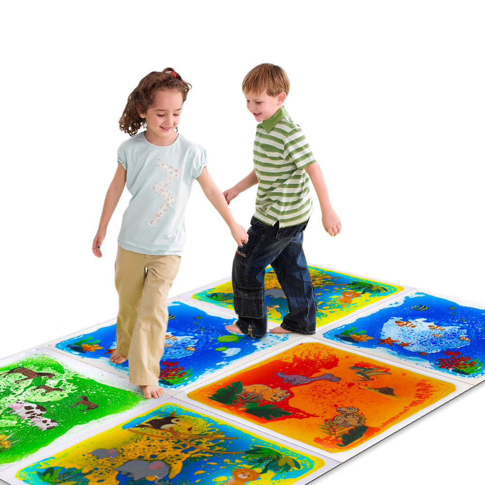 Two kids walking on themed liquid sensory floor tiles