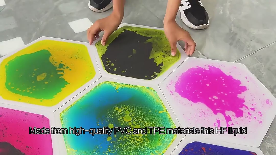 Kids playing on colorful liquid sensory floor tiles
